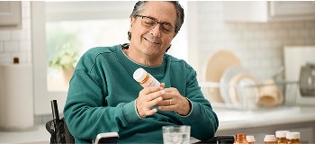 Man reviewing medication